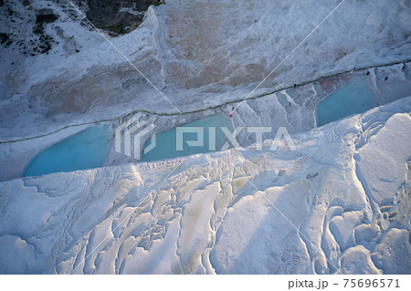 Terraced pools rich with mineral water. Top view. 75696571