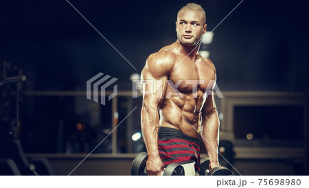 fit man training muscles at gym. fit man training muscles at gym. 75698980