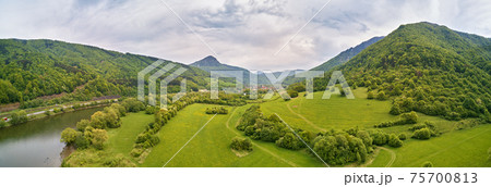 Village, river and road in mountain valley.  Village, river and road in mountain valley.  75700813
