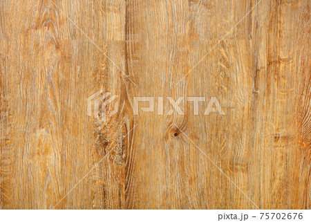 Beautiful texture of a board made of natural light wood with a vertical grain pattern. Beautiful texture of a board made of natural light wood with a vertical grain pattern. 75702676