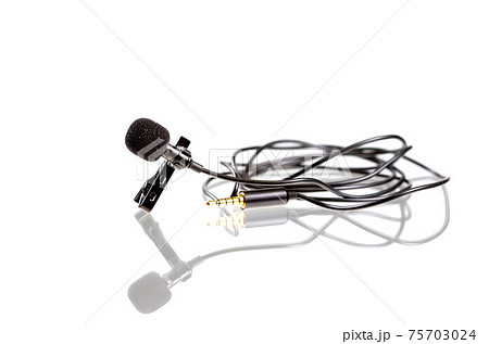 Small lavalier microphone or lapel mic with clip on white background. Small lavalier microphone or lapel mic with clip on white background. 75703024