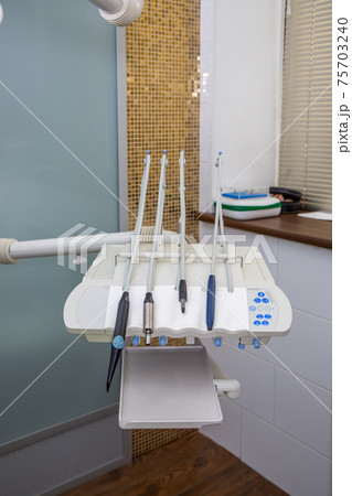 Different dental instruments in the dentists office. Different dental instruments in the dentists office. 75703240