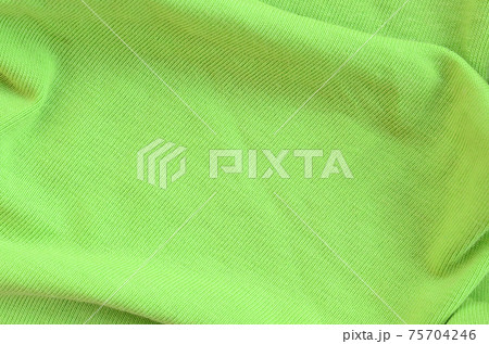 The texture of the fabric is bright green. Material for making shirts and blouses The texture of the fabric is bright green. Material for making shirts and blouses 75704246