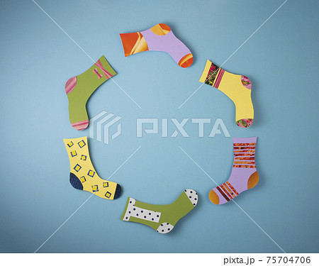 World Down Syndrome Day concept. Different socks made from paper on blue background. 75704706