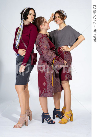 Young white girl on light grey 75704973