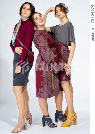 Young white girl on light grey 75704974