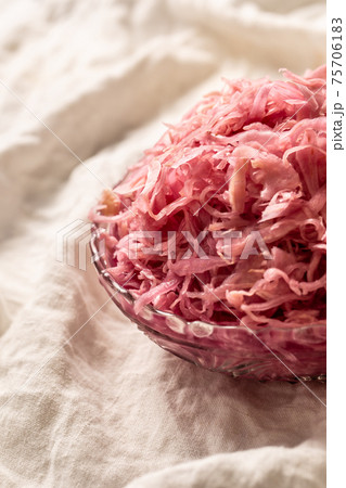 Sour cabbage served in a glass bowl on a rustic tablecloth Sour cabbage served in a glass bowl on a rustic tablecloth 75706183