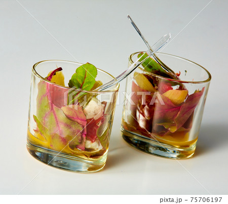 Tasty snacks with beet leaves and cheese in glass. Mediterranean cuisine. Shallow dof. Tasty snacks with beet leaves and cheese in glass. Mediterranean cuisine. Shallow dof. 75706197