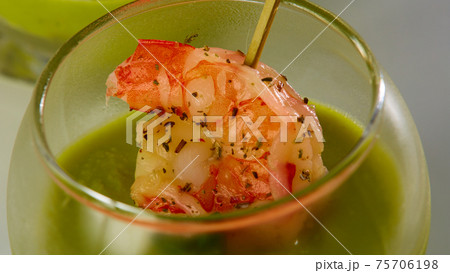 Shrimp cocktail in shot glass shot closeup. Shrimp cocktail in shot glass shot closeup. 75706198