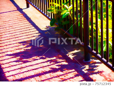 The shadow of a fence falls onto the red, cement pavement. 75712345