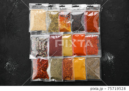 Different spices in plastic package 75719528