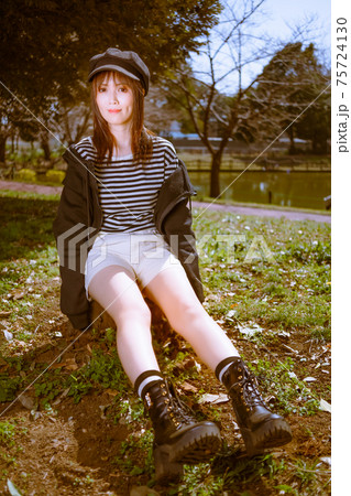 Cute girl sitting on a stump - Stock Photo [75724130] - PIXTA