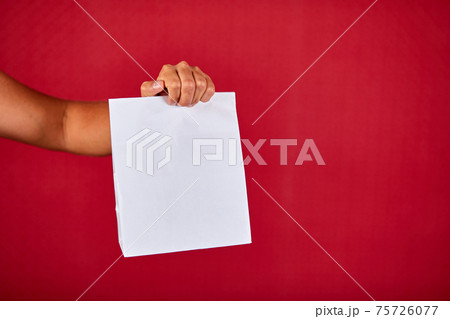 Closeup courier hand holding grocery paper bag, delivery service 75726077