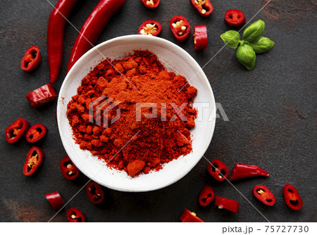 Red chili pepper, dried chillies on dark background. Top view 75727730