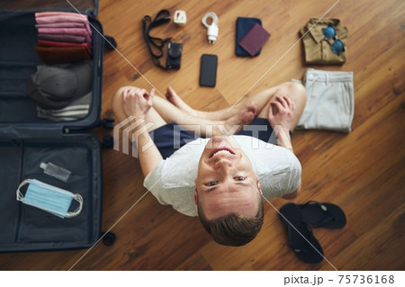 Happy traveler is preparing for travel in new normal Happy traveler is preparing for travel in new normal 75736168