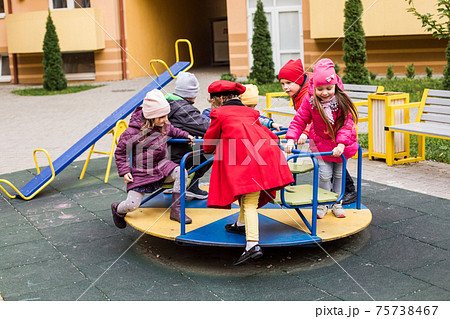 The sad little girlfriends in the playground during quarantine 75738467