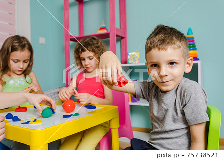 the child enjoys his work at the kindergarten the child enjoys his work at the kindergarten 75738521