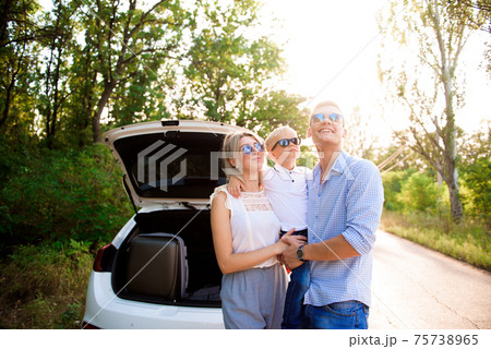 Family, transport, safety, road trip concept - happy man and woman with little child travel. Family, transport, safety, road trip concept - happy man and woman with little child travel. 75738965