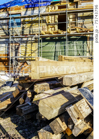 a pile of used wooden building materials on a wooden house restoration site a pile of used wooden building materials on a wooden house restoration site 75743796