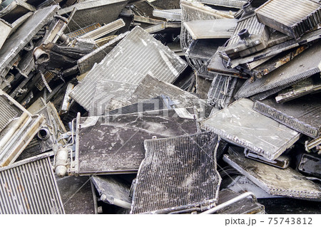 scrap pile of old used car aluminum cooling radiators 75743812