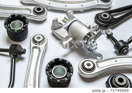 Car inspection. Auto motor mechanic spare or automotive piece on white background. Set of new metal car part. Automobile engine service. Car inspection. Auto motor mechanic spare or automotive piece on white background. Set of new metal car part. Automobile engine service. 75746999
