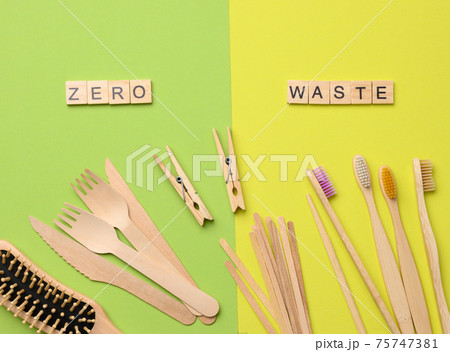 toothbrush, comb, clothespin and other wooden items on green background toothbrush, comb, clothespin and other wooden items on green background 75747381