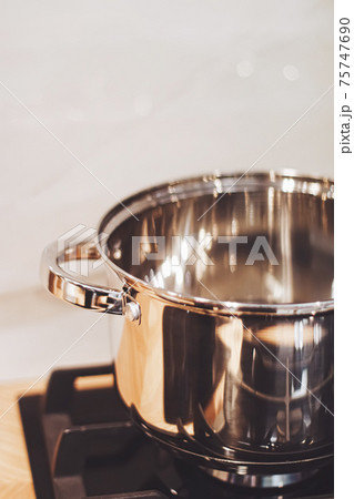Aluminium pot on a kitchen stove, cookware and cooking 75747690