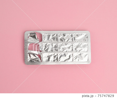 blister pack of capsule pills on a pink background 75747829