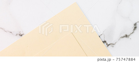 Beige A4 papers on white marble background as office stationery flatlay, luxury branding flat lay and brand identity design for mockup Beige A4 papers on white marble background as office stationery flatlay, luxury branding flat lay and brand identity design for mockup 75747884