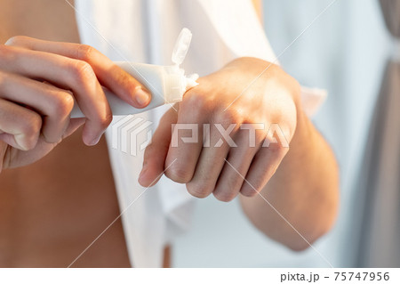 hand care cosmetic product man applying cream tube 75747956