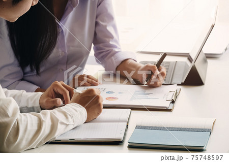 Asian business adviser meeting to analyze and discuss the situation 75748597