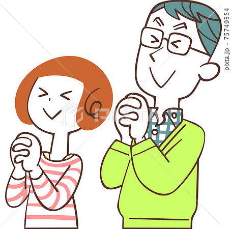 目を瞑って祈る夫婦 75749354