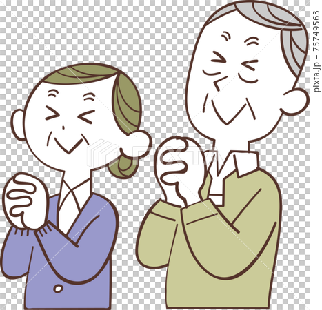 目を瞑って祈るシニアの夫婦 75749563