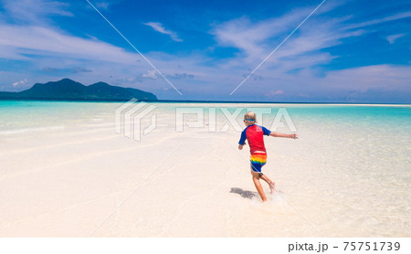 Kids playing on beach. Children play at sea. 75751739