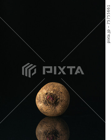 Front view to raw beetroot on black background 75755661
