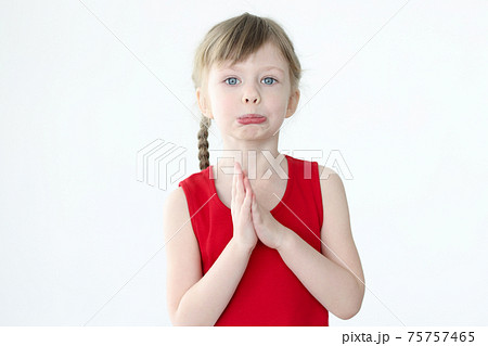 Portrait of an offended little girl with blond hair Portrait of an offended little girl with blond hair 75757465