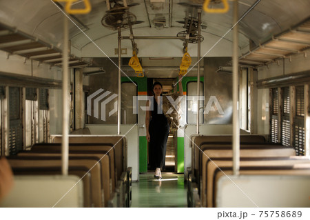 LGBT Transgender model travels on train at station railway LGBT Transgender model travels on train at station railway 75758689