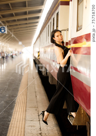 LGBT Transgender model travels on train at station railway LGBT Transgender model travels on train at station railway 75758700