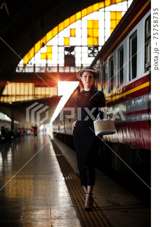 LGBT Transgender model travels on train at station railway LGBT Transgender model travels on train at station railway 75758735