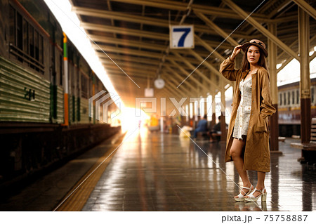Young model travels on train at station railway in Summer Young model travels on train at station railway in Summer 75758887