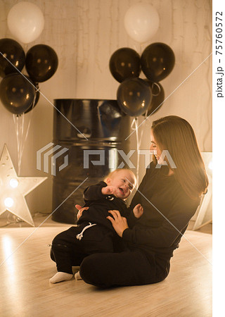 Mom and her toddler son plays in studio 75760572
