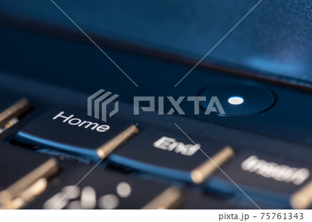 Macro shot of black keyboard focus on home key Macro shot of black keyboard focus on home key 75761343