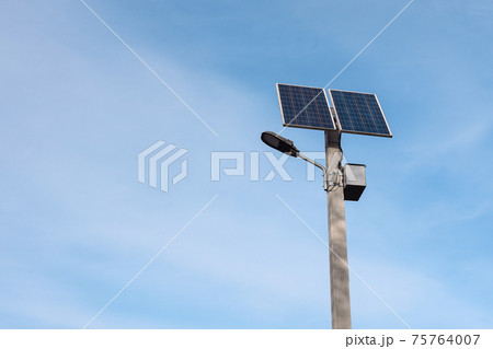 solar panel on a lamppost against the blue sky  75764007