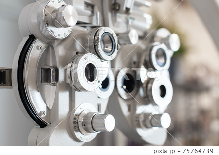 Close up of phoropter eyesight measurement testing machine. Close up of phoropter eyesight measurement testing machine. 75764739