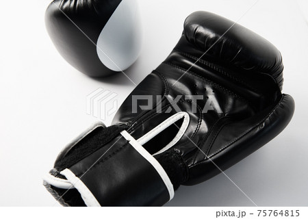 Pair of black boxing gloves on white background, closeup 75764815