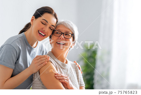 Senior woman after vaccination. 75765823