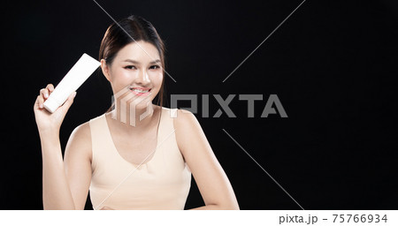 Woman apply Skincare lotion and moisturizer on Skin 75766934