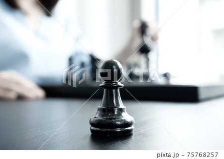 The hands of businesswomen moving chess in chess competitions demonstrate leadership, followers, and strategic plans, business success building processes, and teamwork The hands of businesswomen moving chess in chess competitions demonstrate leadership, followers, and strategic plans, business success building processes, and teamwork 75768257