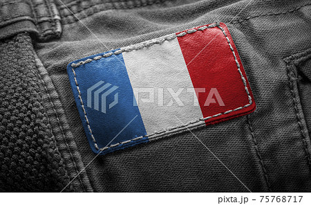 Tag on dark clothing in the form of the flag of the France Tag on dark clothing in the form of the flag of the France 75768717