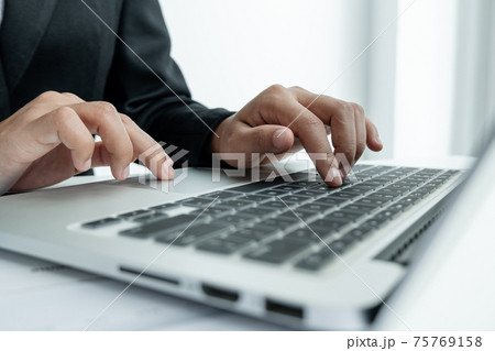 The hands of a male businesswoman are analyzing and calculating the annual income and expenses in a financial graph that shows results To summarize balances overall in office The hands of a male businesswoman are analyzing and calculating the annual income and expenses in a financial graph that shows results To summarize balances overall in office 75769158